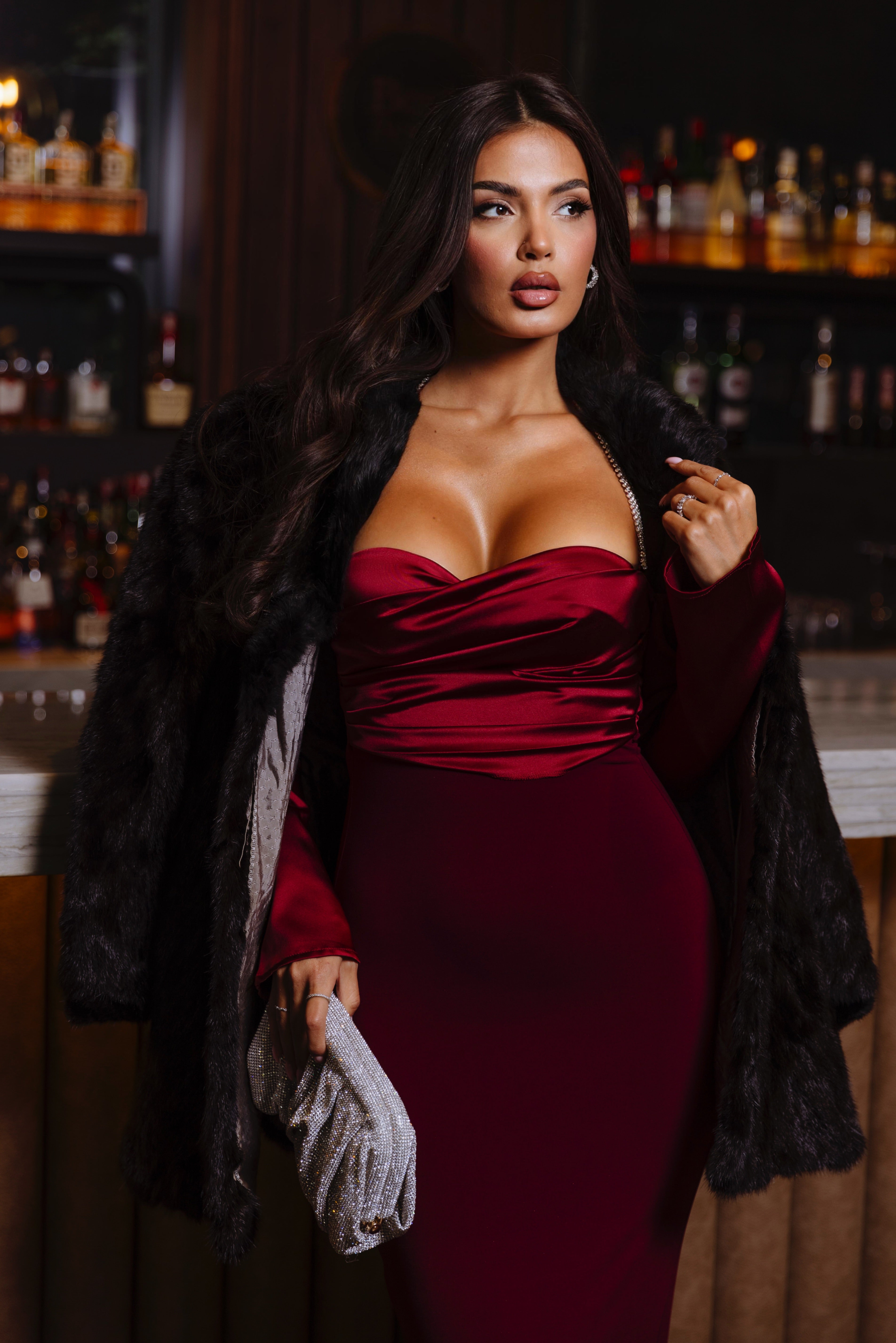 Elegant burgundy satin dress with a sweetheart neckline and ruched detailing.